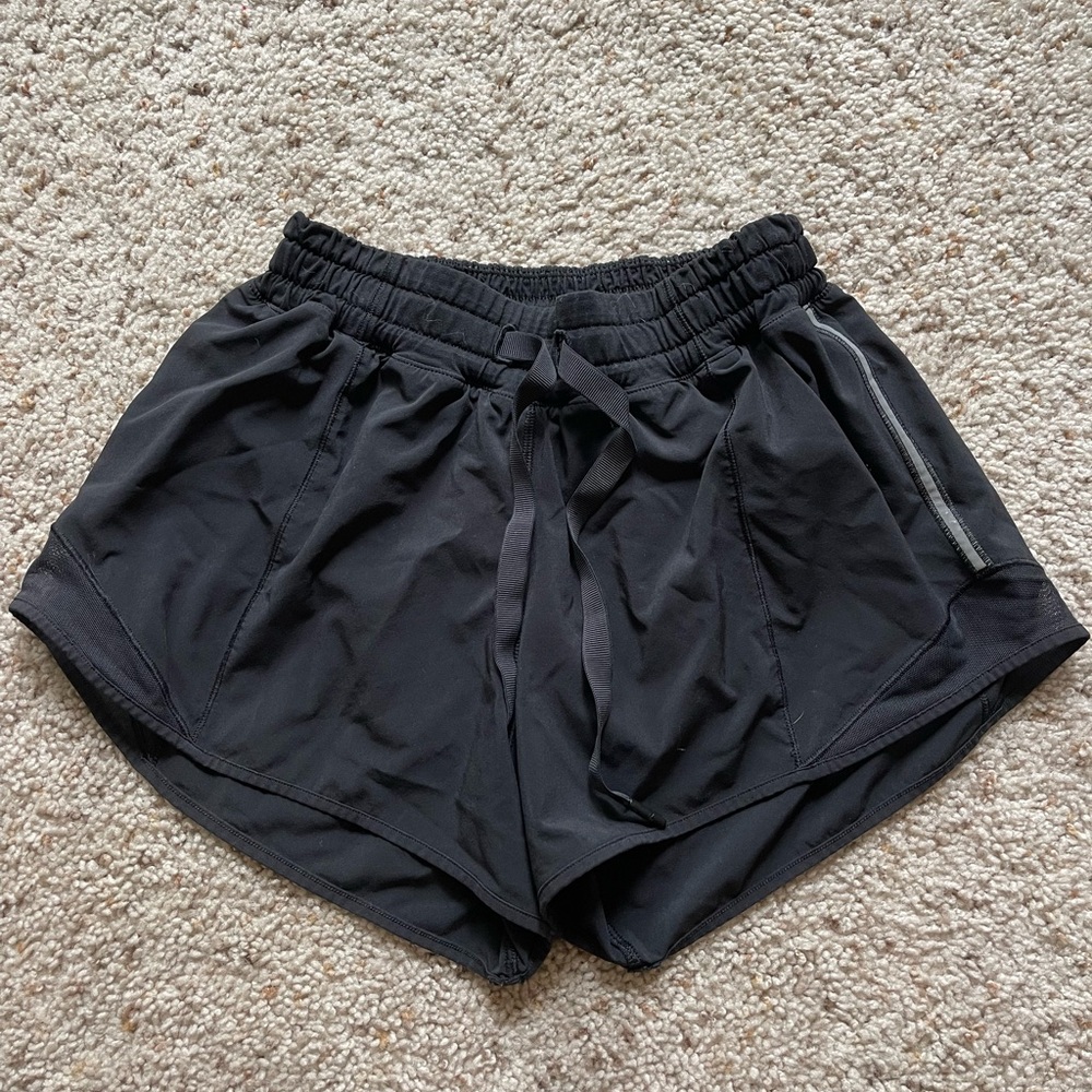 Black lulu lemon athletic shorts. Size 6. Worn with logo missing.
